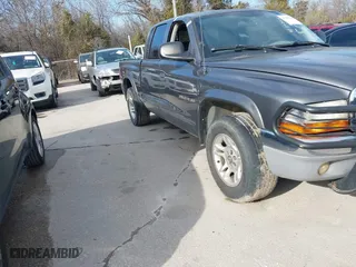 2002 Dodge Dakota SLT with VIN 1B7HL48N52S513091, listed as a IAAI auction lot 41303214 with 158,763 mi miles. Bid and sale history available at carsss.com. Image 1.