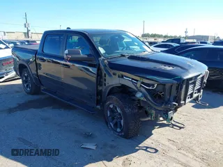 2019 Ram 1500 Rebel z VIN 1C6SRFLT4KN565856, wystawiony jako IAAI lot #41186290 z przebiegiem 81 179 mil mil oraz . Historia ofert i sprzedaży dostępna na DreamBid. Obrazek 1.