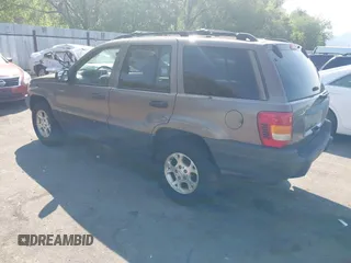 2001 Jeep Grand Cherokee Laredo with VIN 1J4GW48S81C694537, listed as a IAAI auction lot 42447828 with 162,981 mi miles and . Bid and sale history available at DreamBid. Image 3.
