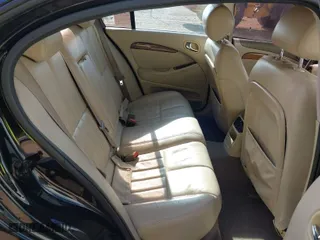 2003 Jaguar S-Type with VIN SAJEA01T43FM88318, listed as a IAAI auction lot 41290433 with 1 mi miles. Bid and sale history available at carsss.com. Image 8.