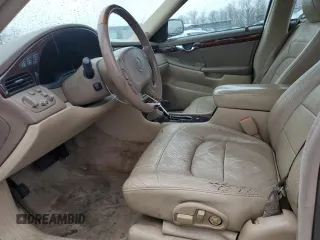 2004 Cadillac DeVille DTS z VIN 1G6KF57944U117834, wystawiony jako Copart lot #89320975 z przebiegiem 149 820 mil mil oraz Szkody całkowita. Historia ofert i sprzedaży dostępna na DreamBid. Obrazek 7.