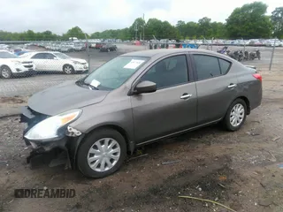 2015 Nissan Versa SV with VIN 3N1CN7AP7FL869485, listed as a IAAI auction lot 42077524 with 198,646 mi miles. Bid and sale history available at carsss.com. Image 2.