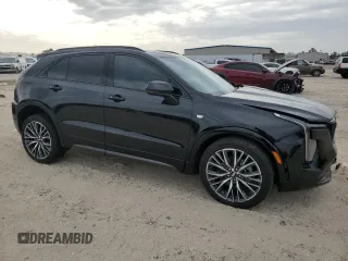 2024 Cadillac XT4 FWD Sport with VIN 1GYFZER46RF213543, listed as a Copart auction lot 83609754 with 3,878 mi miles and Salvage title. Bid and sale history available at DreamBid. Image 4.