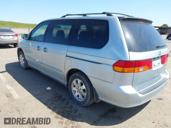 2003 Honda Odyssey EX with VIN 2HKRL18603H502236, listed as a IAAI auction lot 41929501 with 287,538 mi miles and . Bid and sale history available at DreamBid. Image 3.