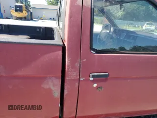 1991 Nissan Frontier XE with VIN 1N6SD11S2MC412375, listed as a Copart auction lot 61015515 with 201,629 mi miles and Salvage title. Bid and sale history available at DreamBid. Image 10.