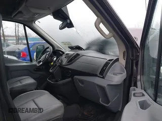 2016 Ford Transit Cargo z VIN 1FTYR2CG8GKB14176, wystawiony jako IAAI lot #41563806 z przebiegiem 93 177 mil mil oraz . Historia ofert i sprzedaży dostępna na DreamBid. Obrazek 5.
