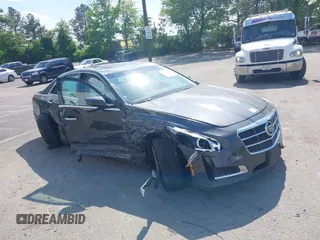 2014 Cadillac CTS Luxury AWD z VIN 1G6AX5SX7E0173466, wystawiony jako IAAI lot #42187266 z przebiegiem 115 140 mil mil oraz . Historia ofert i sprzedaży dostępna na DreamBid. Obrazek 1.