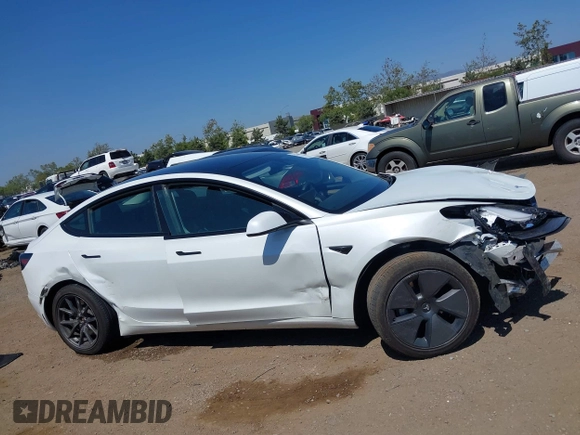 2023 Tesla Model 3 with VIN 5YJ3E1EA2PF571569, listed as a IAAI auction lot 42288715 with 30,271 mi miles and . Bid and sale history available at DreamBid. Image 13.