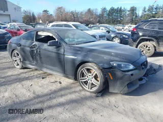 2015 BMW 6 Series 650i xDrive z VIN WBAYM1C53FD325258, wystawiony jako IAAI lot #41292094 z przebiegiem 94 016 mil mil oraz . Historia ofert i sprzedaży dostępna na DreamBid. Obrazek 1.