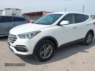2017 Hyundai Santa Fe 2.4L with VIN 5NMZTDLB5HH018198, listed as a IAAI auction lot 42523632 with 144,883 mi miles and . Bid and sale history available at DreamBid. Image 2.