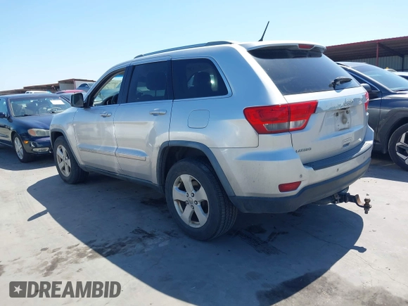 2012 Jeep Grand Cherokee Laredo with VIN 1C4RJEAG5CC112230, listed as a IAAI auction lot 41997483 with 302,923 mi miles. Bid and sale history available at carsss.com. Image 14.