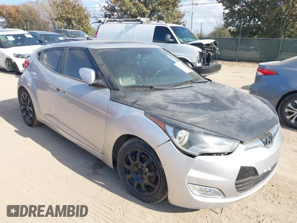 2012 Hyundai Veloster w/Gray Int with VIN KMHTC6AD0CU068400, listed as a IAAI auction lot 41493521 with 72,682 mi miles and . Bid and sale history available at DreamBid. Image 1.