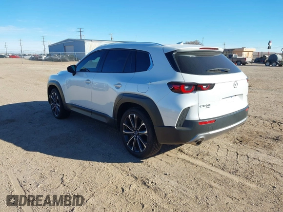 2024 Mazda CX-50 Premium z VIN 7MMVABDY0RN186511, wystawiony jako IAAI lot #41229255 z przebiegiem 21 842 mil mil oraz . Historia ofert i sprzedaży dostępna na DreamBid. Obrazek 3.