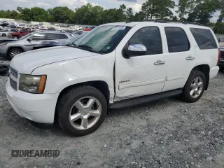 2011 Chevrolet Tahoe LS with VIN 1GNSCAE08BR394917, listed as a Copart auction lot 60470395 with 143,824 mi miles and Salvage title. Bid and sale history available at DreamBid. Image 1.