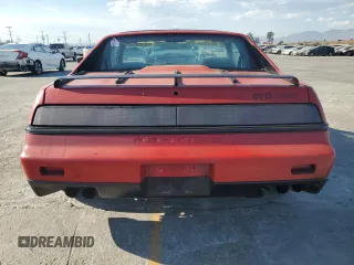 1986 Pontiac Fiero z VIN 1G2PF379XGP215474, wystawiony jako Copart lot #73346514 z przebiegiem 71 955 mil mil oraz Tytuł czysty. Historia ofert i sprzedaży dostępna na DreamBid. Obrazek 6.