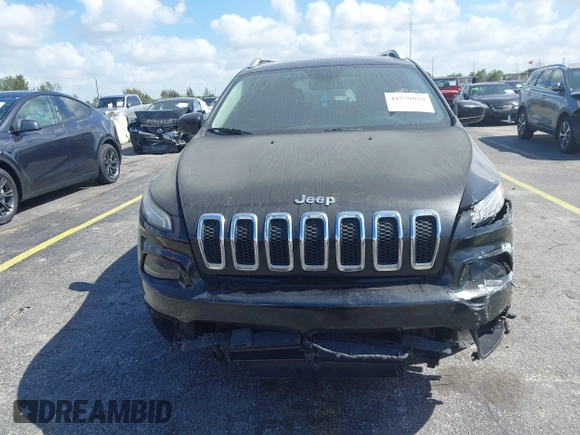 2015 Jeep Cherokee Latitude with VIN 1C4PJLCB4FW683904, listed as a IAAI auction lot 41579059 with 126,156 mi miles and . Bid and sale history available at carsss.com. Image 12.