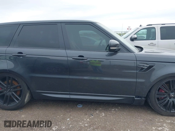 2018 Land Rover Range Rover Sport z VIN SALWR2RE3JA182033, wystawiony jako IAAI lot #41888457 z przebiegiem 103 941 mil mil oraz . Historia ofert i sprzedaży dostępna na DreamBid. Obrazek 13.