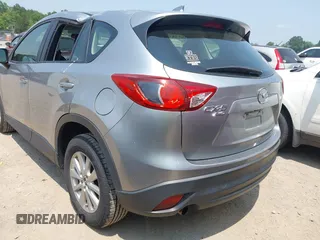 2014 Mazda CX-5 Sport with VIN JM3KE4BE9E0411177, listed as a IAAI auction lot 42411938 with 167,709 mi miles and . Bid and sale history available at DreamBid. Image 3.