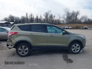 2013 Ford Escape SE with VIN 1FMCU9GX1DUB69236, listed as a IAAI auction lot 41575494 with 122,075 mi miles and . Bid and sale history available at DreamBid. Image 13.