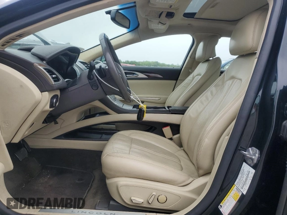 2014 Lincoln MKZ with VIN 3LN6L2J97ER817852, listed as a Copart auction lot 60980885 with 77,194 mi miles and Salvage title. Bid and sale history available at DreamBid. Image 7.