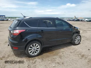 2018 Ford Escape Titanium with VIN 1FMCU9J95JUB31286, listed as a Copart auction lot 58721355 with 100,329 mi miles and Salvage title. Bid and sale history available at DreamBid. Image 3.