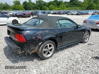 2001 Ford Mustang Deluxe z VIN 1FAFP44431F180282, wystawiony jako Copart lot #63592905 z przebiegiem 191 016 mil mil oraz Szkoda całkowita • Salvage title. Historia ofert i sprzedaży dostępna na DreamBid. Obrazek 3.