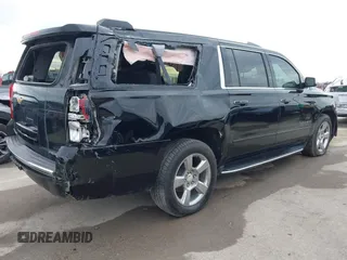 2019 Chevrolet Suburban Premier with VIN 1GNSKJKC7KR261826, listed as a IAAI auction lot 41652451 with 127,032 mi miles and . Bid and sale history available at DreamBid. Image 4.