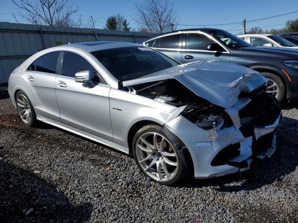 2015 Mercedes-Benz CLS-Class CLS 400 with VIN WDDLJ6HB9FA148000, listed as a Copart auction lot 52300255 with 98,709 mi miles and Salvage Title. Bid and sale history available at carsss.com. Image 4.
