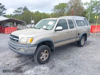 2002 Toyota Tundra SR5 with VIN 5TBBT44112S292924, listed as a IAAI auction lot 41958993 with 216,550 mi miles. Bid and sale history available at carsss.com. Image 2.