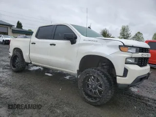 2019 Chevrolet Silverado 1500 Custom with VIN 3GCPYBEH7KG227329, listed as a Copart auction lot 50712934 with 99,428 mi miles and Salvage Title. Bid and sale history available at DreamBid. Image 4.
