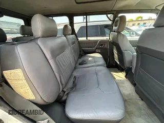 2000 Mitsubishi Montero z VIN JA4MR51R6YJ002305, wystawiony jako Copart lot #50263015 z przebiegiem 138 861 mil mil oraz Czysty tytuł • Clean title. Historia ofert i sprzedaży dostępna na DreamBid. Obrazek 6.
