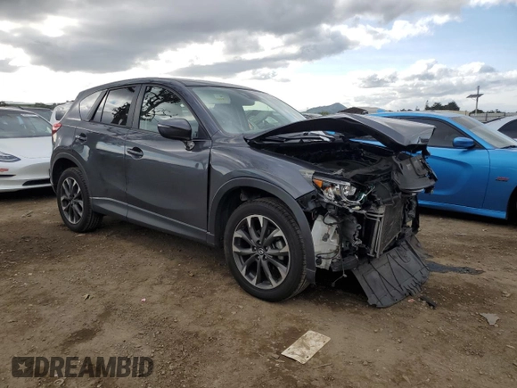 2016 Mazda CX-5 Grand Touring with VIN JM3KE2DY4G0795271, listed as a Copart auction lot 50986845 with 92,323 mi miles and Salvage Title. Bid and sale history available at carsss.com. Image 4.