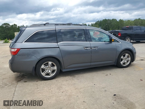2012 Honda Odyssey Touring with VIN 5FNRL5H90CB050580, listed as a Copart auction lot 58502925 with 226,929 mi miles and Salvage title. Bid and sale history available at DreamBid. Image 3.