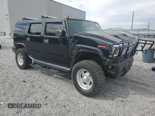 2004 Hummer H2 z VIN 5GRGN23U74H100175, wystawiony jako Copart lot #52642125 z przebiegiem 112 305 mil mil oraz Szkoda całkowita • Salvage title. Historia ofert i sprzedaży dostępna na DreamBid. Obrazek 4.