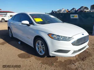 2018 Ford Fusion Hybrid S with VIN 3FA6P0UU0JR204324, listed as a IAAI auction lot 41312303 with 100,527 mi miles. Bid and sale history available at carsss.com. Image 1.