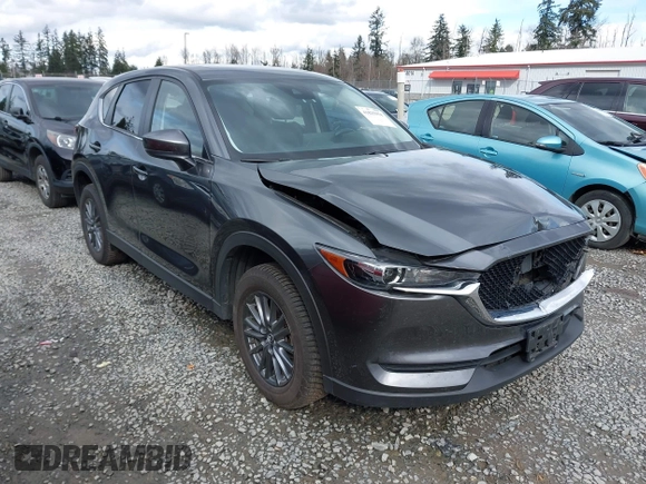 2021 Mazda CX-5 Touring with VIN JM3KFBCM2M0484011, listed as a IAAI auction lot 41825954 with 48,958 mi miles. Bid and sale history available at carsss.com. Image 1.