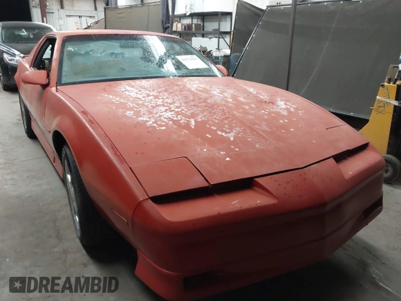 1990 Pontiac Firebird z VIN 1G2FS23T9LL219603, wystawiony jako IAAI lot #41774239 z przebiegiem 135 648 mil mil oraz . Historia ofert i sprzedaży dostępna na DreamBid. Obrazek 6.