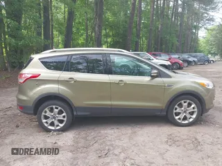 2014 Ford Escape Titanium with VIN 1FMCU9JX9EUB23972, listed as a IAAI auction lot 42217298 with 164,556 mi miles and . Bid and sale history available at DreamBid. Image 13.