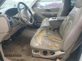 1999 Ford F-150 z VIN 1FTRX17WXXNC10010, wystawiony jako Copart lot #55607785 z przebiegiem Nie podano mil oraz Szkoda całkowita • Salvage title. Historia ofert i sprzedaży dostępna na DreamBid. Obrazek 7.