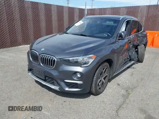 2018 BMW X1 xDrive28i with VIN WBXHT3C30J5L34702, listed as a IAAI auction lot 41935803 with 42,174 mi miles. Bid and sale history available at carsss.com. Image 2.