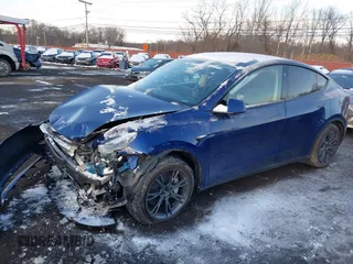 2024 Tesla Model Y Long Range with VIN 7SAYGDEE2RF129577, listed as a IAAI auction lot 41357180 with 6,697 mi miles and . Bid and sale history available at DreamBid. Image 2.
