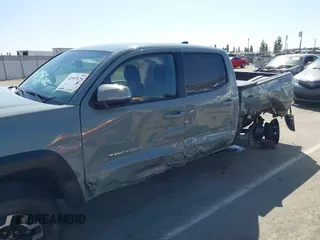 2022 Toyota Tacoma SR with VIN 3TMCZ5AN0NM489420, listed as a IAAI auction lot 42597175 with 129,340 mi miles and . Bid and sale history available at DreamBid. Image 6.