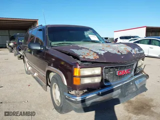 1997 GMC Suburban with VIN 1GKEC16RXVJ703491, listed as a IAAI auction lot 41219414 with 362,551 mi miles. Bid and sale history available at carsss.com. Image 1.