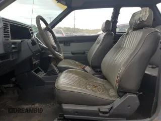 1987 Nissan Sentra z VIN JN1PB2210HU557007, wystawiony jako Copart lot #68174784 z przebiegiem 150 316 mil mil oraz Tytuł czysty. Historia ofert i sprzedaży dostępna na DreamBid. Obrazek 7.