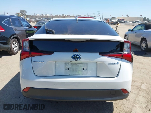 2021 Toyota Prius L Eco with VIN JTDKAMFU8M3135142, listed as a IAAI auction lot 42317007 with 77,353 mi miles and . Bid and sale history available at DreamBid. Image 16.