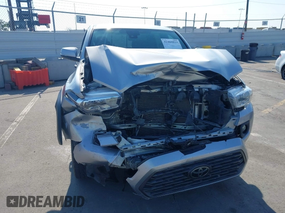 2021 Toyota Tacoma SR with VIN 5TFCZ5AN6MX270972, listed as a IAAI auction lot 42460823 with 76,062 mi miles and . Bid and sale history available at DreamBid. Image 6.
