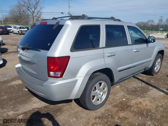 2010 Jeep Grand Cherokee Laredo with VIN 1J4PR4GK5AC161442, listed as a IAAI auction lot 41939994 with 137,376 mi miles. Bid and sale history available at carsss.com. Image 4.