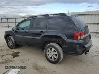 2010 Mitsubishi Endeavor LS with VIN 4A4JM2AS0AE011338, listed as a Copart auction lot 83211414 with 104,582 mi miles and Salvage Title. Bid and sale history available at carsss.com. Image 2.