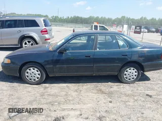 1995 Toyota Camry LE z VIN 4T1SK12E3SU576500, wystawiony jako IAAI lot #42186816 z przebiegiem 216 809 mil mil oraz . Historia ofert i sprzedaży dostępna na DreamBid. Obrazek 13.