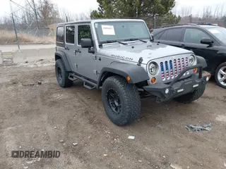 2013 Jeep Wrangler Unlimited Rubicon with VIN 1C4BJWFG7DL667083, listed as a IAAI auction lot 42016912 with 148,933 mi miles and . Bid and sale history available at DreamBid. Image 1.